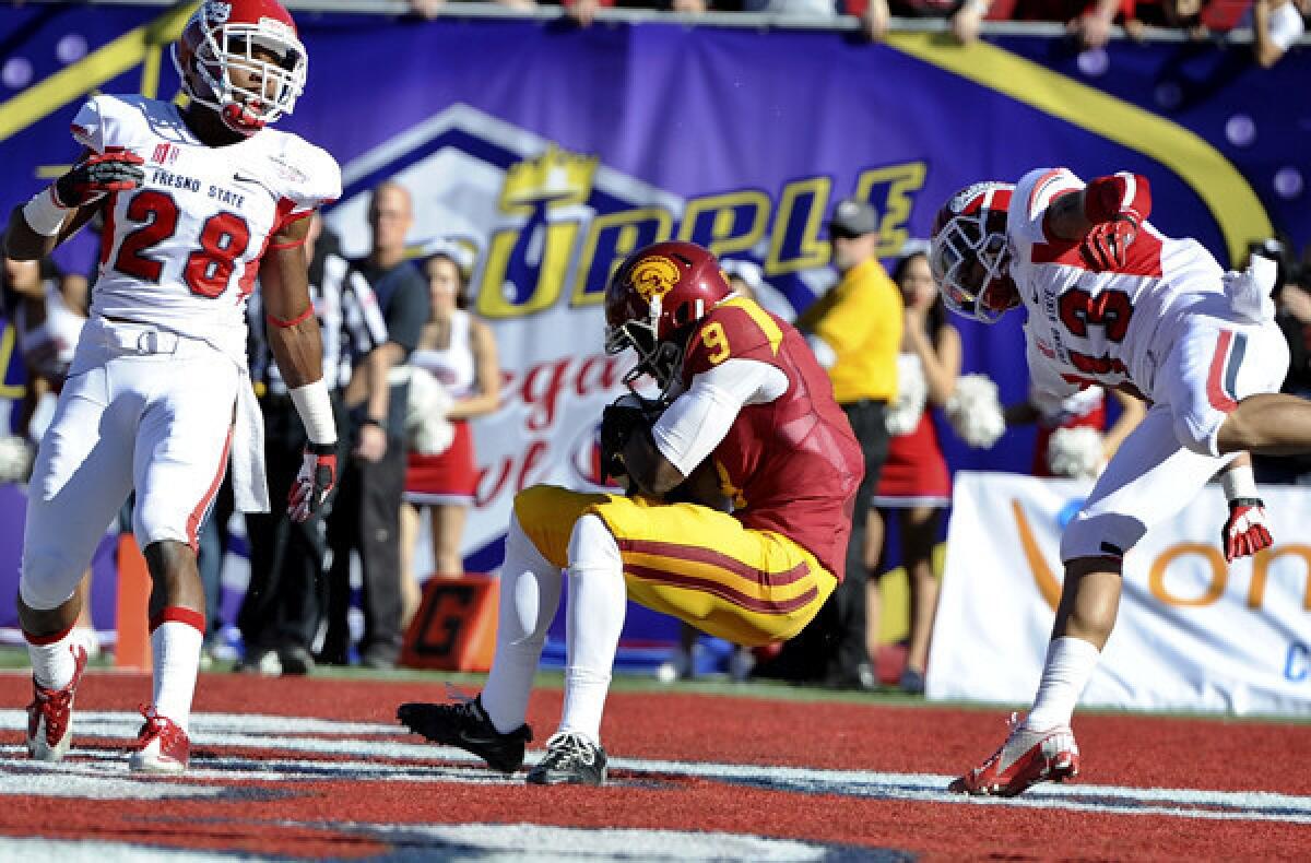 USC receiver Marqise Lee (9) hauls in a 10-yard touchdown reception against Fresno State in the first quarter of the Royal Purple Las Vegas Bowl on Saturday.