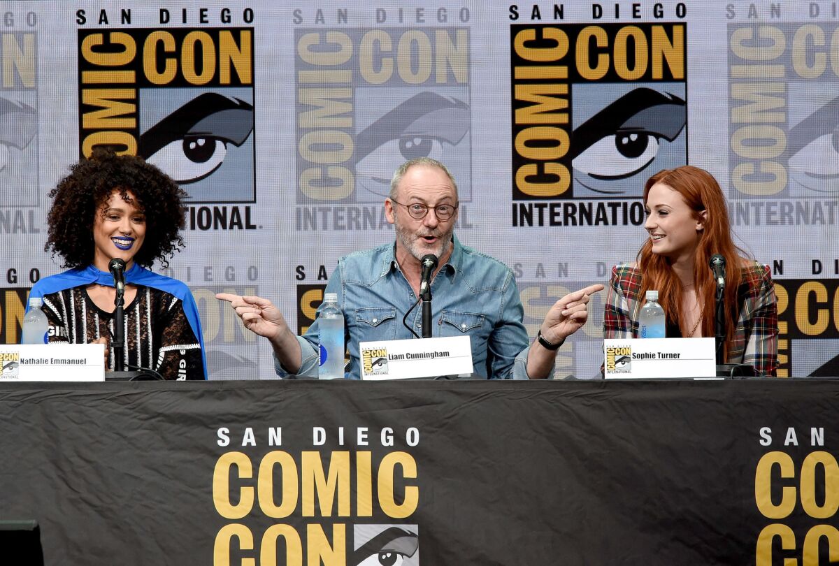 From left: Actors Nathalie Emmanuel, Liam Cunningham and Sophie Turner onstage at Comic-Con International 2017 "Game Of Thrones" panel and Q&A session (Photo by Kevin Winter/Getty Images)