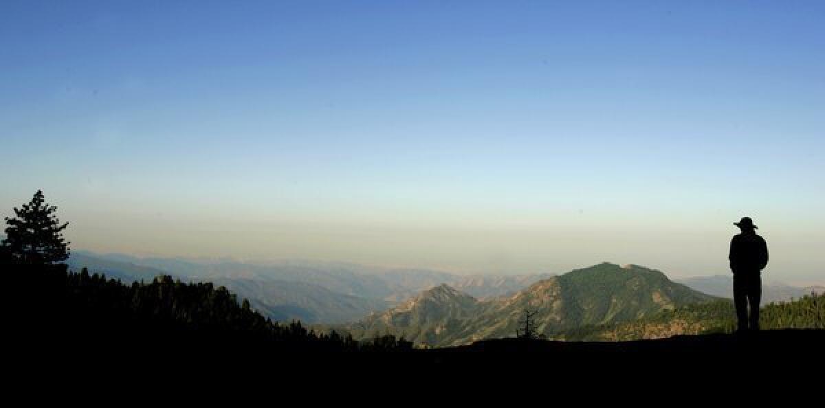 A layer of smog sits above the San Joaquin Valley in this early-morning view from Beetle Rock in Sequoia National Park.