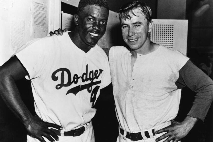 The Brooklyn Dodgers featured two future Hall of Famers in the middle of their infield -- second baseman Jackie Robinson and shortstop Pee Wee Reese, who befriended Robinson as he broke baseball's color barrier.