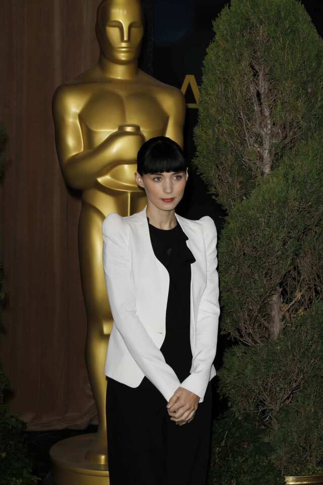 Rooney Mara is nominated for lead actress for her role in "The Girl With the Dragon Tattoo."