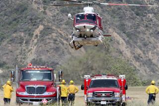 An OCFA helicopter lands after dropping search and rescue members