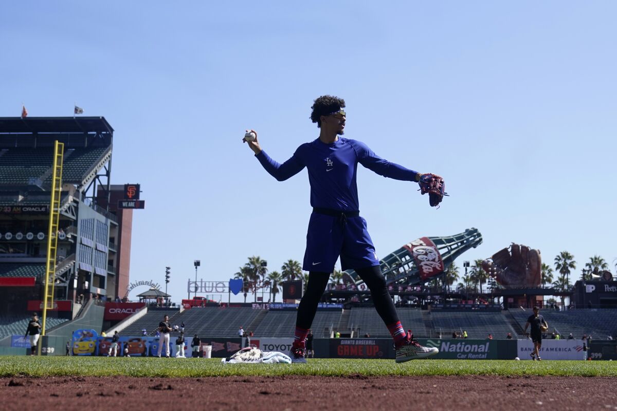 Dodgers' Miguel Vargas warms up before a game against the San Francisco Giants.