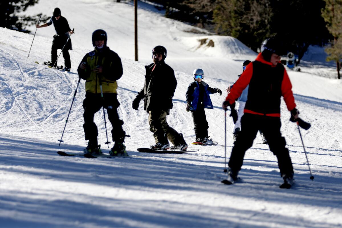 People ski and snowboard at Big Bear.