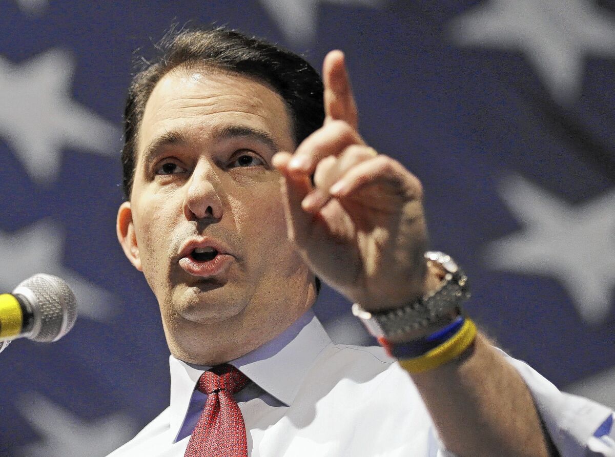 Wisconsin Republican Gov. Scott Walker in May. The state Supreme Court handed the governor two victories Thursday.