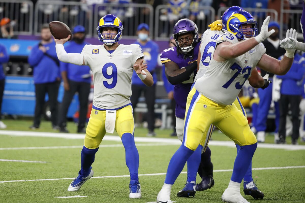 Rams quarterback Matthew Stafford (9) throws a pass during the second half against the Minnesota Vikings.