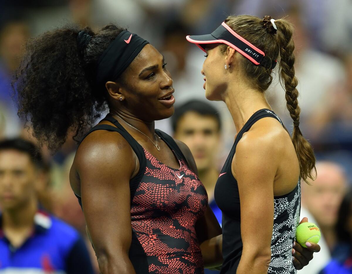 Serena Williams, left, and Vitalia Diatchenko meet at the net after Diatchenko withdrew during their first round match in the 2015 U.S. Open.