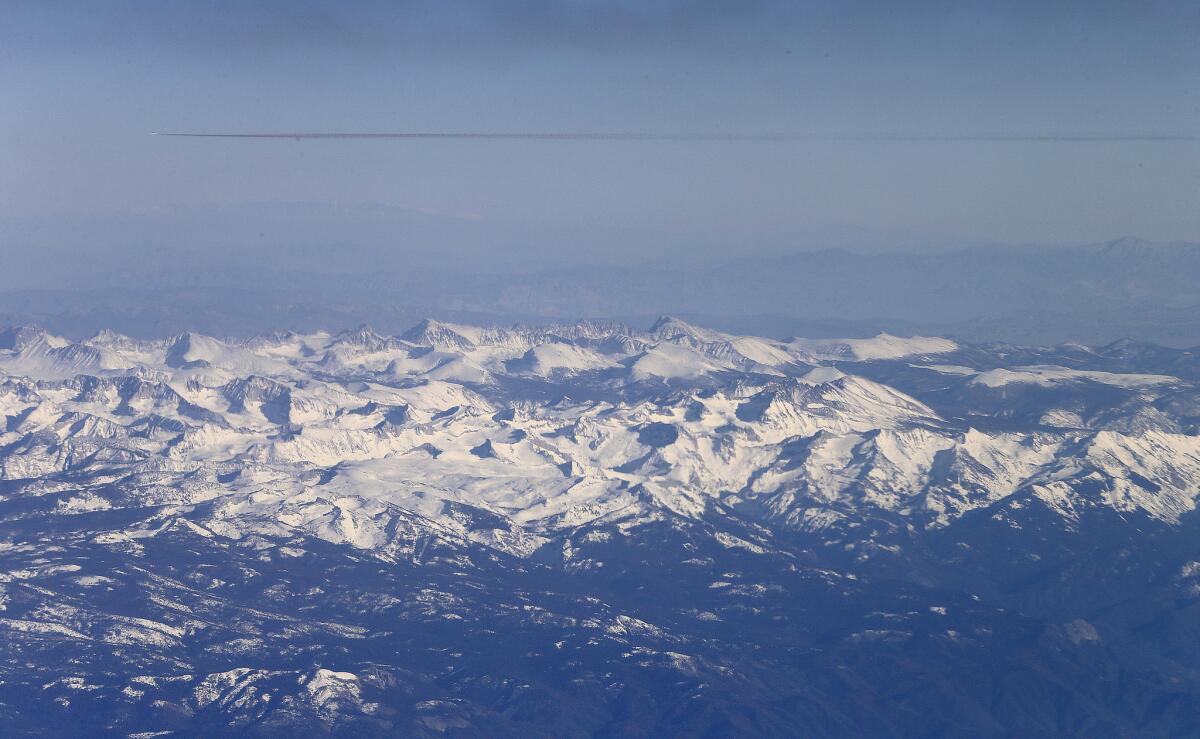 An aerial view of the snow-capped Sierra Nevada in January shows how conditions have improved since last spring.