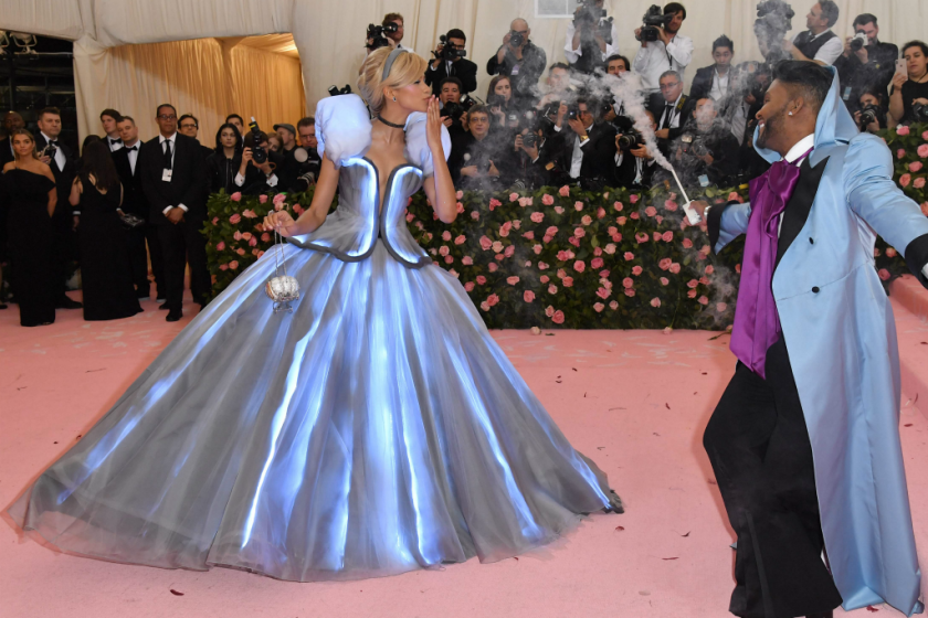 Zendaya went full Cinderella in a light-up Tommy Hilfiger gown with stylist Law Roach (with smoking wand, right) playing the role of the transformative fairy godmother. Zendaya was already on our list of favorites -- even before she left a glass slipper on the pink carpet on the way into the gala.
