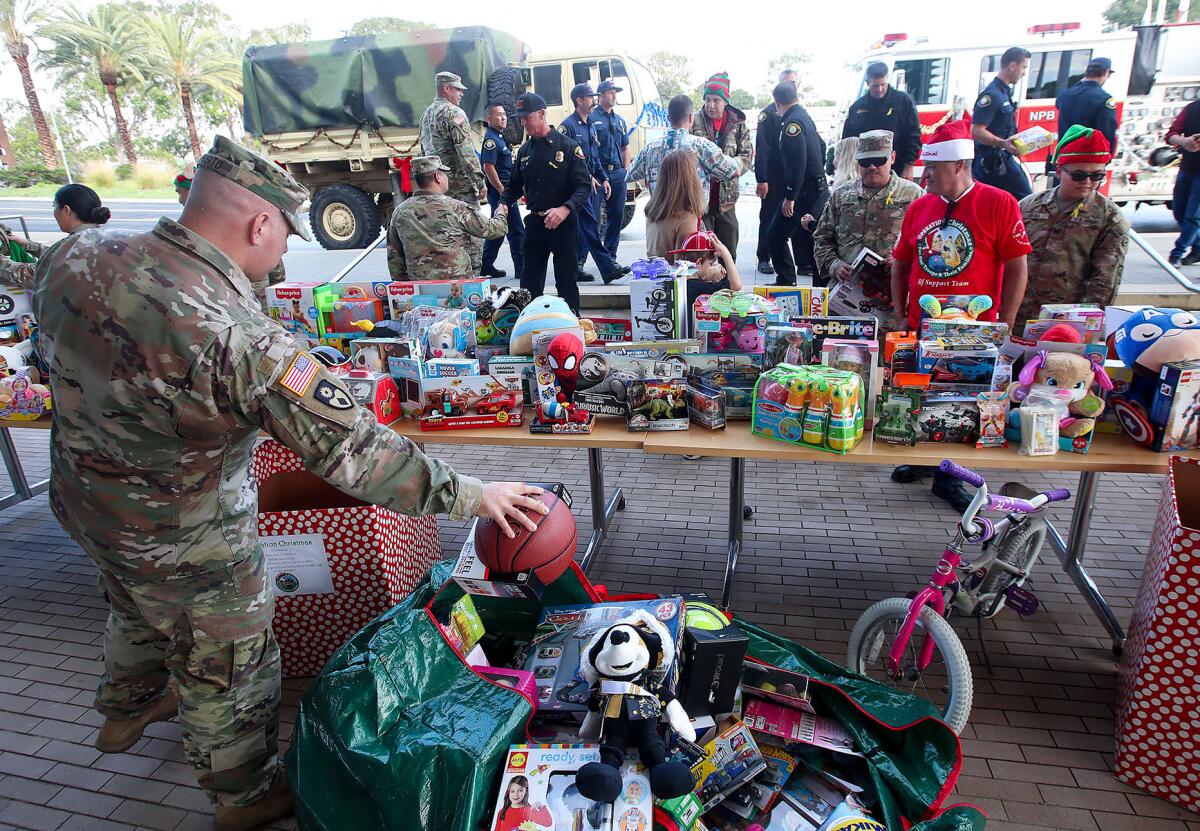 Members of the aviation battalion from Joint Forces Training Base Los Alamitos participate in Operation Christmas.