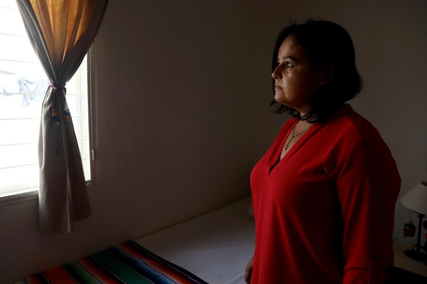 AJIJIC, JALISCO - SEPTEMBER 29: Fabiana Ramirez Flores, 51, at her home on Wednesday, Sept. 29, 2021 in Ajijic, Jalisco. Fabiana Ramirez Flores, 51, who is undocumented, was the first woman to come forward after being sexually assaulted by Dr. Esmail Nadjmabadi in 2005. He threatened to call ICE on her if she didn't withdraw her complaint. Fabiana lives with her husband Carlos Valle Perez, 53, in Ajiijic, Mexico. (Gary Coronado / Los Angeles Times)