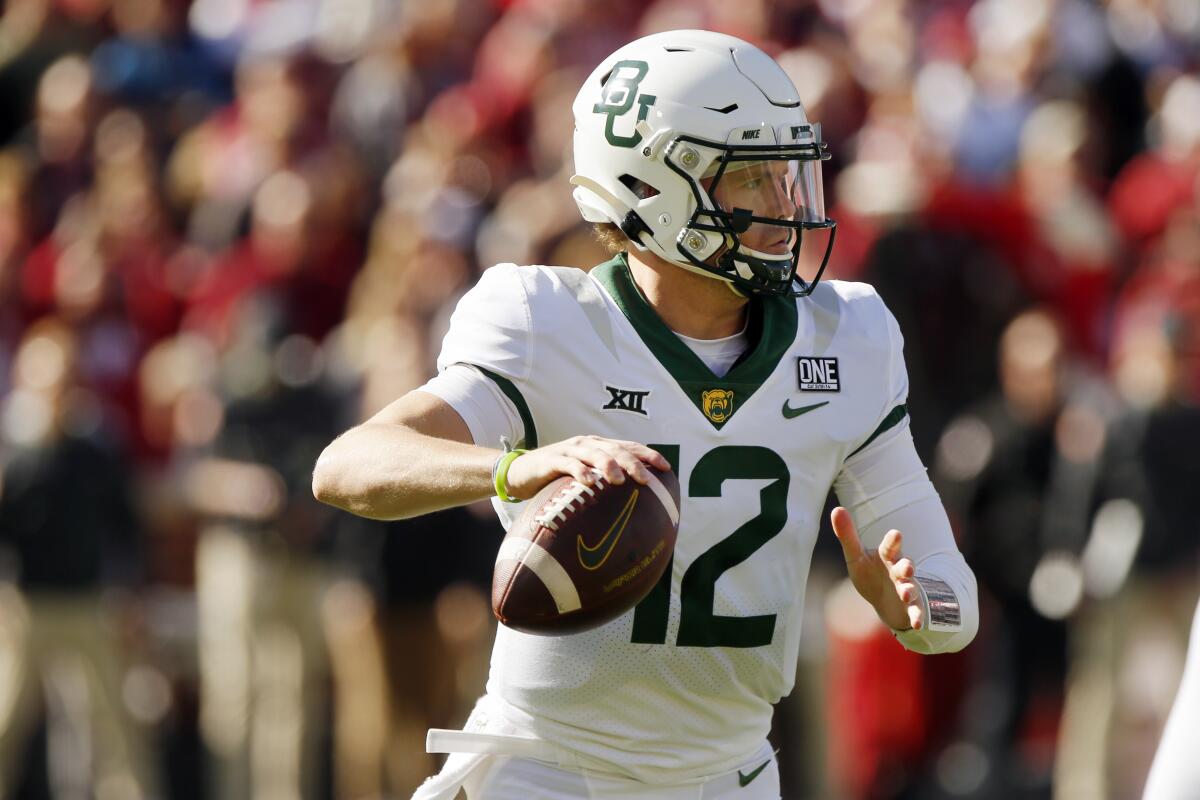 Baylor quarterback Blake Shapen looks for a receiver against Oklahoma in the first half of an NCAA college football game, Saturday, Nov. 5, 2022, in Norman, Okla. (AP Photo/Nate Billings)