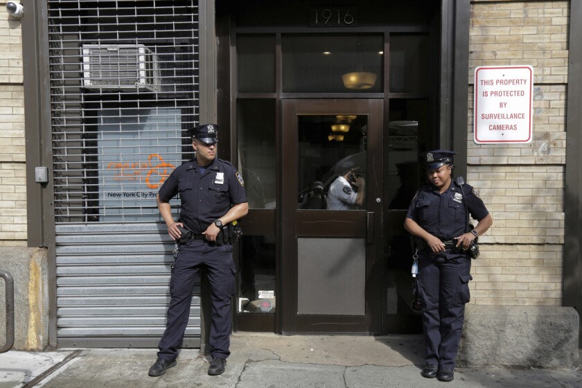 Police stand outside an office for the Cayuga Centers in the Brooklyn borough of New York.