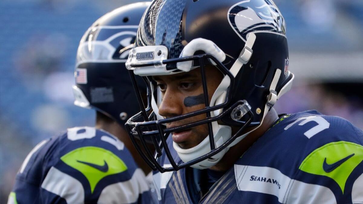 Seattle Seahawks quarterback Russell Wilson warms up before a preseason game against the Minnesota Vikings on Thursday.