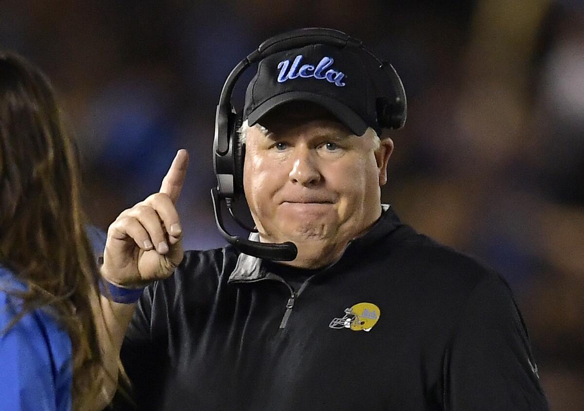 Chip Kelly gestures on the sideline during a 2018 game for UCLA.