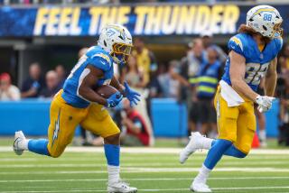 Chargers running back J.K. Dobbins (27) breaks free for a long run against the Las Vegas Raiders.