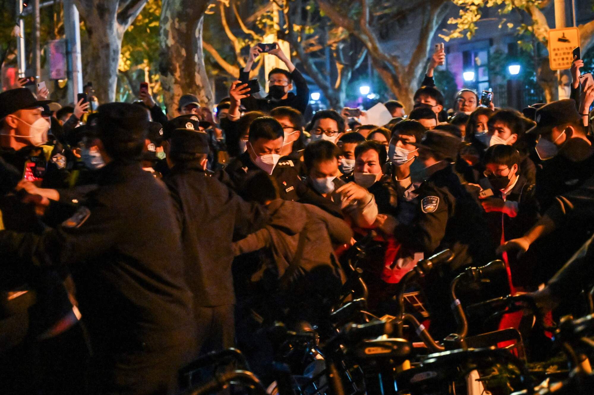 Police and people are pictured during some clashes in Shanghai