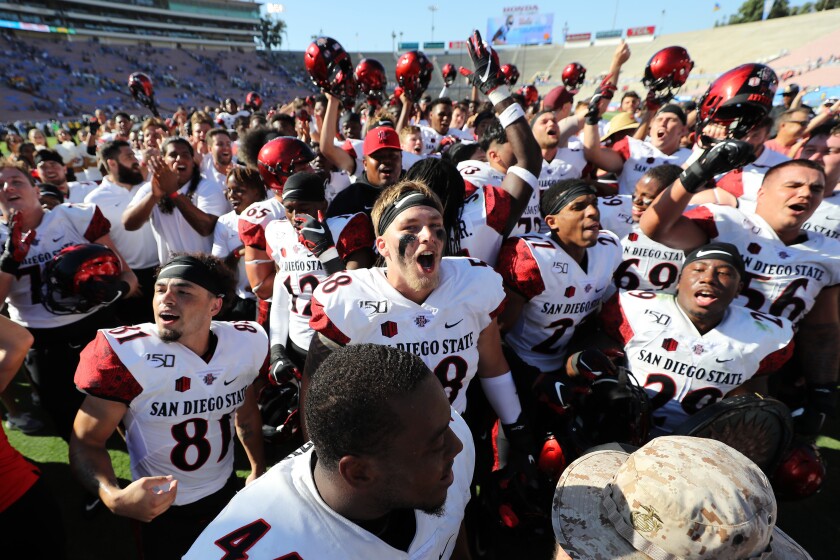 San Diego State players celebrate defeating UCLA, 23-14, in 2019 at the Rose Bowl.