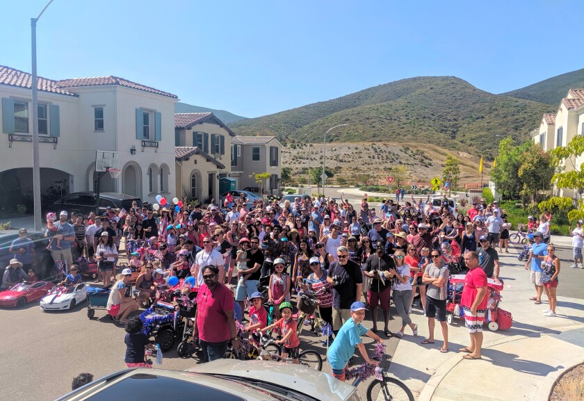 Residents show their spirit on the Fourth of July at the master plan in San Marcos. Events held throughout the year have helped build a sense of community.
