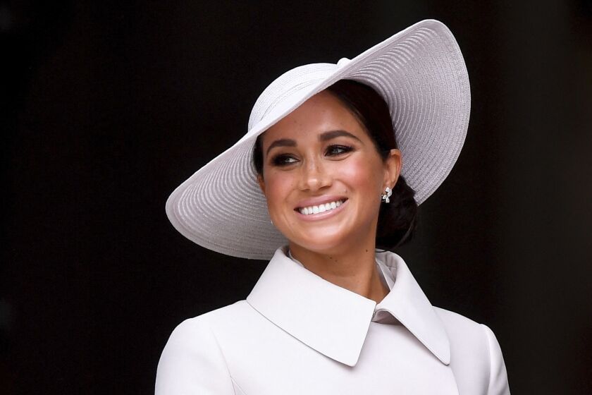 FILE - Meghan, Duchess of Sussex smiles after attending a service of thanksgiving for the reign of Queen Elizabeth II at St Paul's Cathedral in London June 3, 2022 to mark the Platinum Jubilee. Buckingham Palace has investigated how staff handled allegations of bullying made against Meghan. But the findings will remain private. Palace officials told reporters Wednesday, June 30, 2022, that the details of the independent review were not being released because of the confidentiality of those who took part. (Toby Melville, Pool Photo via AP, File)