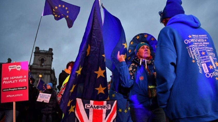 Anti-Brexit activists demonstrate outside of the Houses of Parliament in London on Jan. 15, 2019.