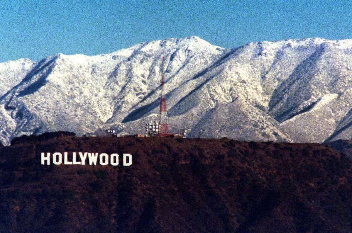 A wintertime shot from the Baldwin Hills toward the Hollywood sign, backed by the San Gabriel Mountains. The whole place inspired the look of the movies; no wonder non-Angelenos think of the place, unjustly, as fake.