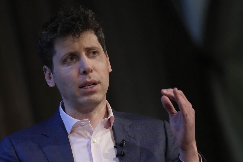 FILE - OpenAI's CEO Sam Altman gestures while speaking at University College London as part of his world tour of speaking engagements in London, on May 24, 2023. Altman said Monday, June 5, 2023 he was encouraged by a desire shown by world leaders to contain any risks posed by the artificial intelligence technology his company and others are developing. (AP Photo/Alastair Grant, File)