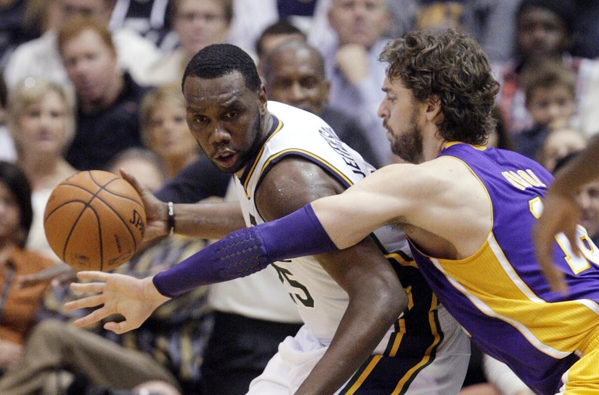 Pau Gasol defends Utah center Al Jefferson during the Lakers' 95-85 loss to the Jazz last month.