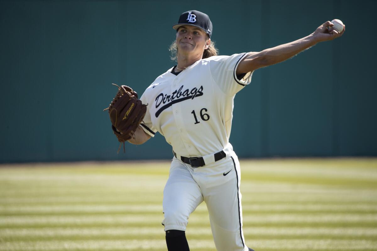 Long Beach State pitcher Adam Seminaris warms up before a game.