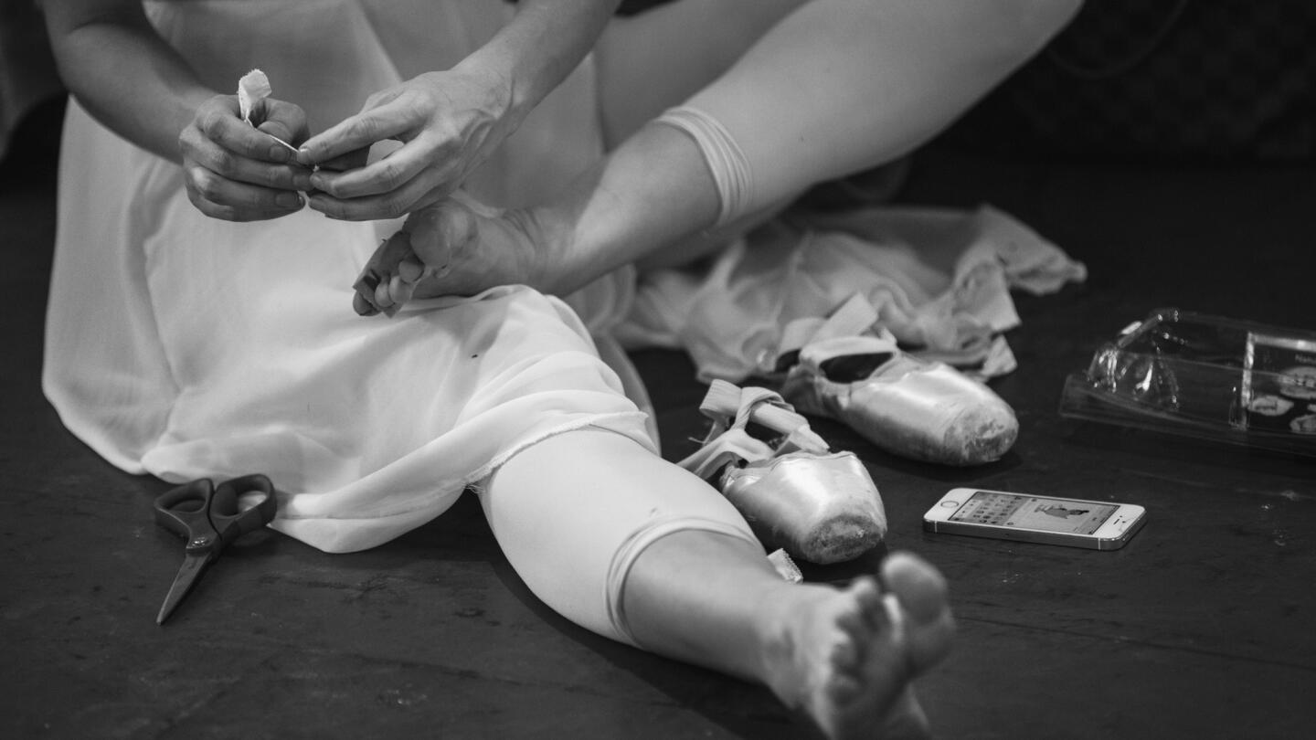 A dancer with Los Angeles Ballet tapes her feet before beginning rehearsals at LAB's West L.A. studios in April. Its last production of its ninth season is "Directors' Choice/Masterworks of the 20th Century," with a show at Glendale's Alex Theatre on May 30 and a final show at UCLA's Royce Hall June 6.