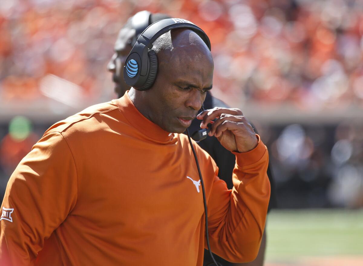 Texas Coach Charlie Strong walks along the sideline during an Oct. 1 game against Oklahoma State in Stillwater, Okla.