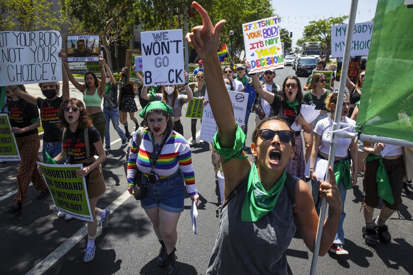 West Hollywood, CA - May 07: Micaela Bronstein, 34, and other abortion rights supporters and activists from Rise Up 4 Abortion Rights LA march on Santa Monica Blvd. on Saturday, May 7, 2022 in West Hollywood, CA. (Irfan Khan / Los Angeles Times)