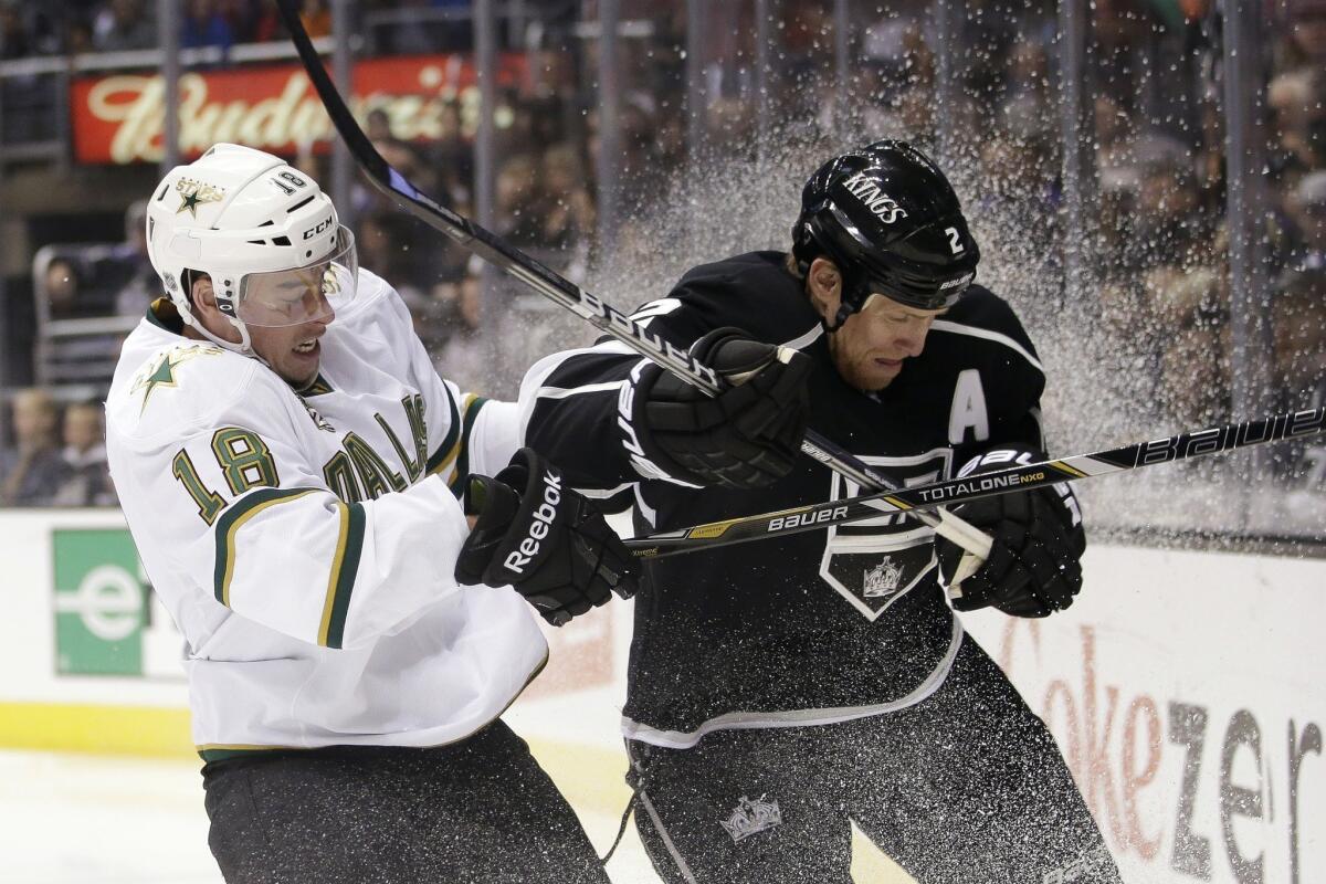 Matt Greene, right, shown mixing it up with Dallas' Reilly Smith on Sunday at Staples Center, will play against the Wild on Tuesday in his third game since returning from back surgery.