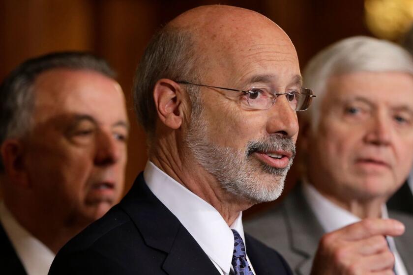 FILE - In this Oct. 7, 2015, file photo, Pennsylvania Gov. Tom Wolf, center, accompanied by state House Minority Leader Rep. Frank Dermody, right, D-Allegheny, and state Rep. Joe Markosek, left, D-Allegheny, discuss state budget negotiations at the state Capitol in Harrisburg, Pa. It's deadline day in Pennsylvania's gerrymandering case for Democratic Gov. Wolf and others to submit maps of new congressional district boundaries that they want the state's Supreme Court to adopt. The midnight deadline Thursday, Feb. 15, 2018, gives justices four more days to impose new boundaries, just three months before Pennsylvania's primary elections. (AP Photo/Matt Rourke, File)