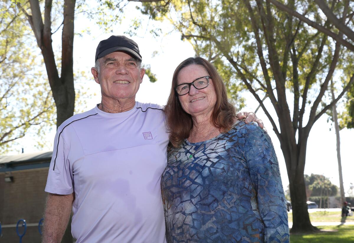 Hank Lloyd stands with wife Maureen in front of the Costa Mesa Tennis Center on Tuesday.