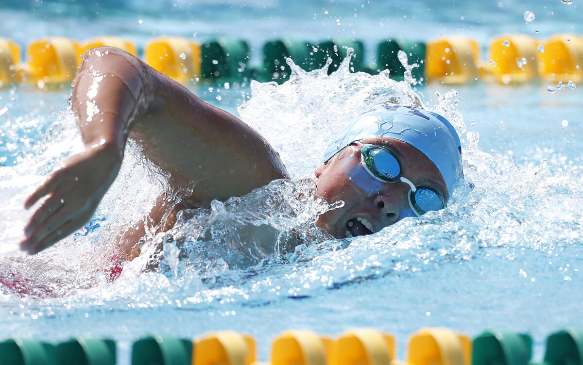 Corona del Mar's Taylor Park swims the girls' 200 free during the Surf League swim finals on Friday at Golden West College.