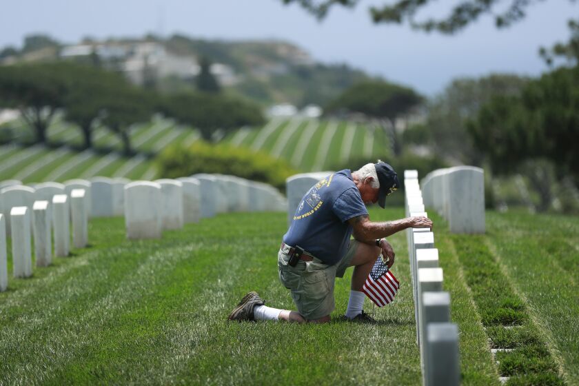 Nihil Smith pays respect to his longtime friend U.S. Marine Corps Lt. Col. Kenneth Pipes, a Silver Star and Purple Heart recipient at Fort Rosecrans National Cemetery on May 24, 2020, a day before Memorial Day.