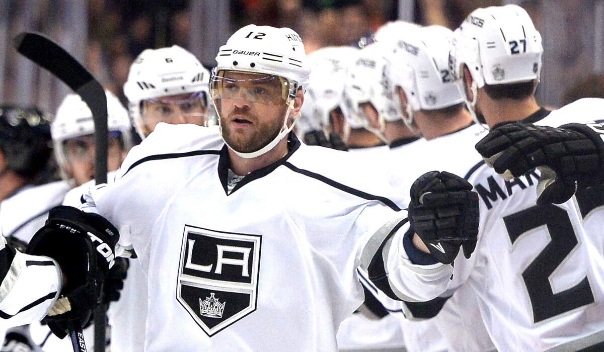 Right wing Marian Gaborik is congratulated by teammates after scoring against the Ducks in the first period of Game 2.