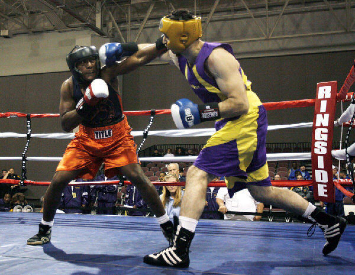 In this May 4, 2009 photo, Tamerlan Tsarnaev, right, fights during the 2009 Golden Gloves National Boxing Tournament.