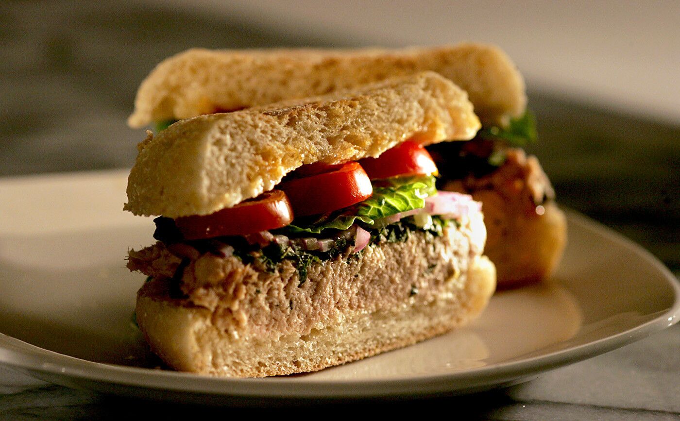 Shiso is a natural with tuna, adding a fragrant green note to an easy sandwich of salty capers, meaty Italian tuna and sweet tomatoes.