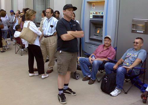 Customers wait outside of the IndyMac headquarters in Pasadena for the bank to open. The FDIC took over ailing IndyMac bank on Friday.