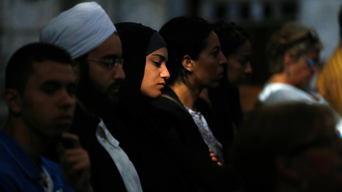 Muslims and Christians attend a Mass in tribute to slain French priest Jacques Hamel at the Rouen cathedral on July 31, 2016.