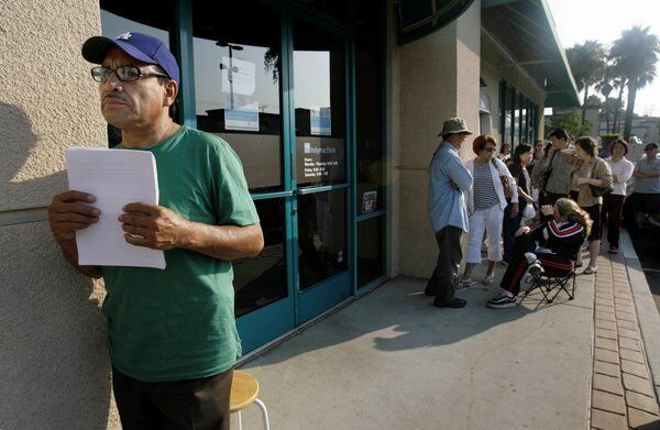 Miguel Gonzalez, left, waits for his appointment at an IndyMac Federal Bank in Monterey Park. IndyMac Chief Executive Michael W. Perry rarely met a nontraditional loan he didn't like, and the Pasadena savings and loan was sucked under by stated-income mortgages that required no documentation of ability to pay. As regulators seized IndyMac in July 2008, its branches resembled scenes from the Great Depression, with panicked depositors lining up in the heat to withdraw funds. Perry staunchly denied wrongdoing, portraying himself as the victim of the housing crash and overaggressive regulators. But he agreed in December 2012 to pay $1 million to settle government claims that he overloaded IndyMac with risky loans. He was also barred from the banking industry for life. Cost: $13 billion.
