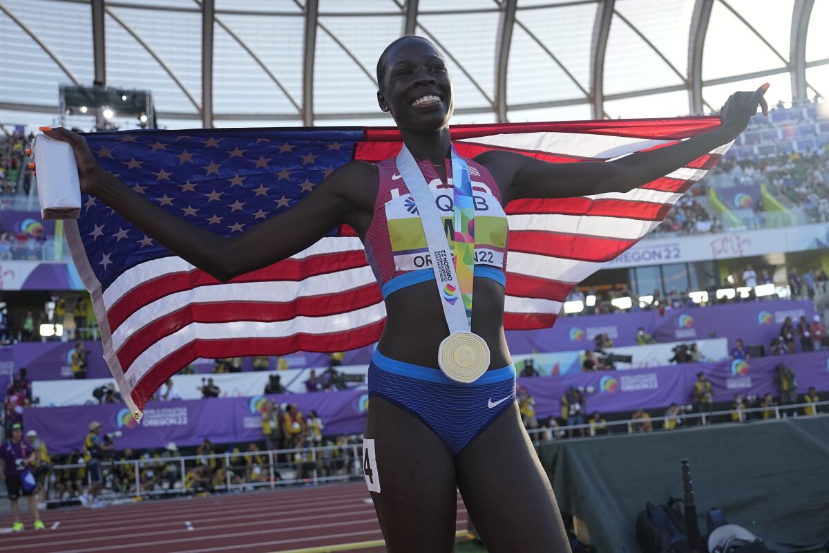 U.S. runner Athing Mu celebrates after winning gold in the women's 800 meters on Sunday.