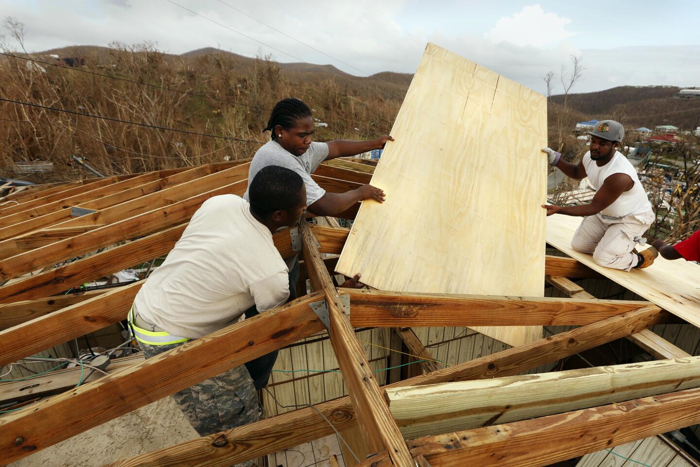 In Cruz Bay on St. John in the Virgin Islands, which already took a severe lashing from Hurricane Irma, workers rush to fix a roof in advance of Hurricane Maria.