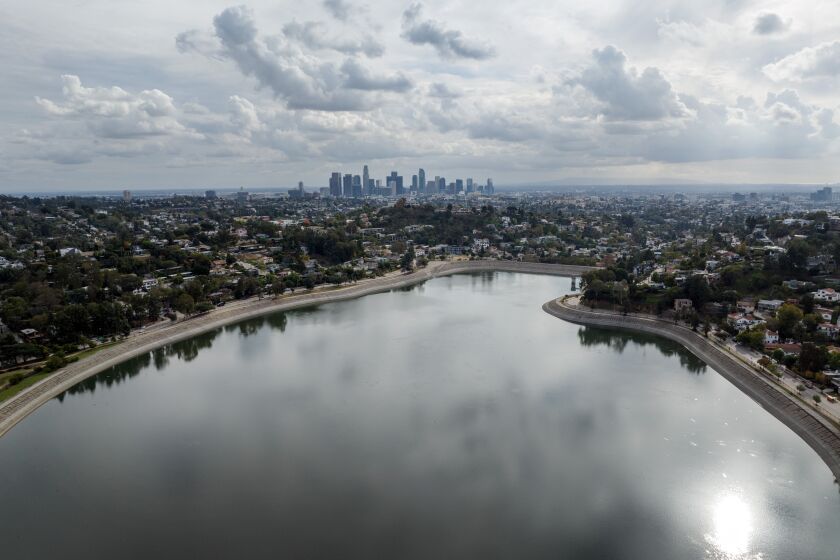 LOS ANGELES, CA - DECEMBER 06: Clouds move into Los Angeles, as seen from the Silver Lake Reservoir, bringing a chance of rain. Photographed on Tuesday, Dec. 6, 2022 in Los Angeles, CA. (Myung J. Chun / Los Angeles Times)