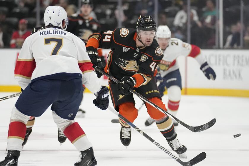 Anaheim Ducks left wing Ross Johnston (44) passes against Florida Panthers defenseman.