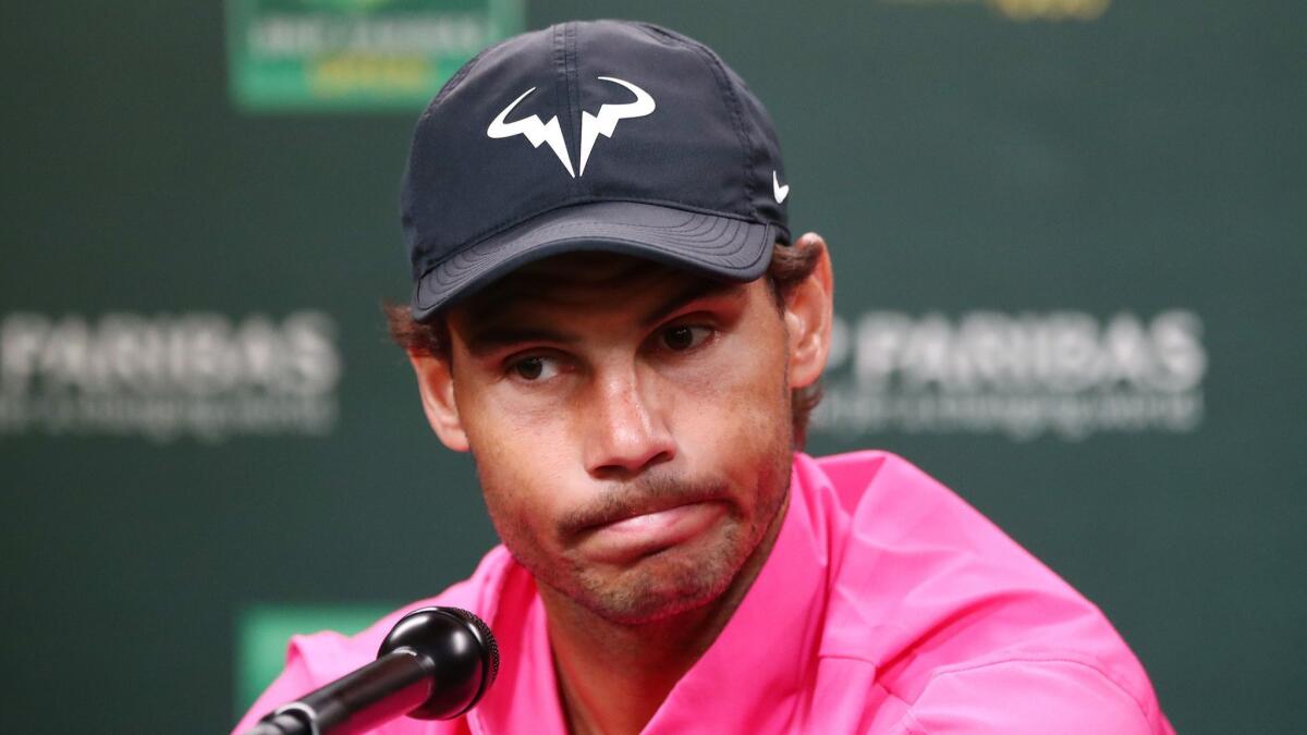 Rafael Nadal addresses the media after he withdrew from the Paribas Open on Saturday because of a knee injury.