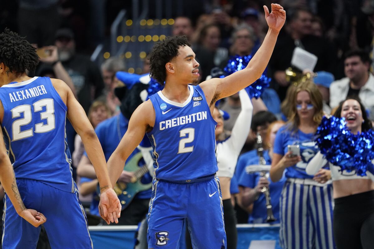Creighton guard Ryan Nembhard gestures near the end of the team's second-round college basketball game against Baylor in the men's NCAA Tournament on Sunday, March 19, 2023, in Denver. (AP Photo/John Leyba)