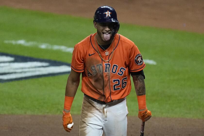 Houston Astros' Jose Siri reacts after striking out during the fourth inning in Game 2 of baseball's World Series between the Houston Astros and the Atlanta Braves Wednesday, Oct. 27, 2021, in Houston. (AP Photo/Ashley Landis)